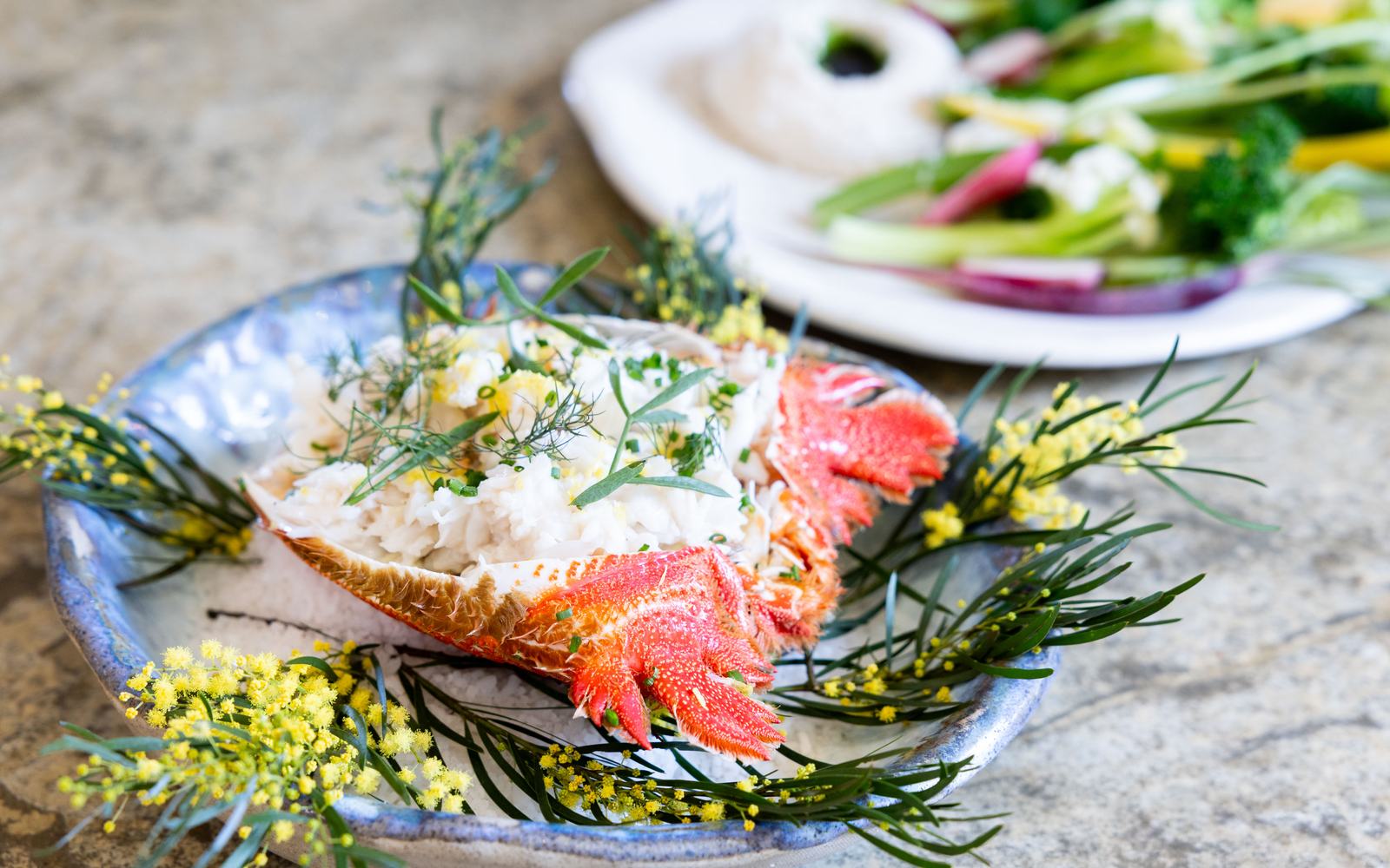 A plate of fresh local seafood and native herbs